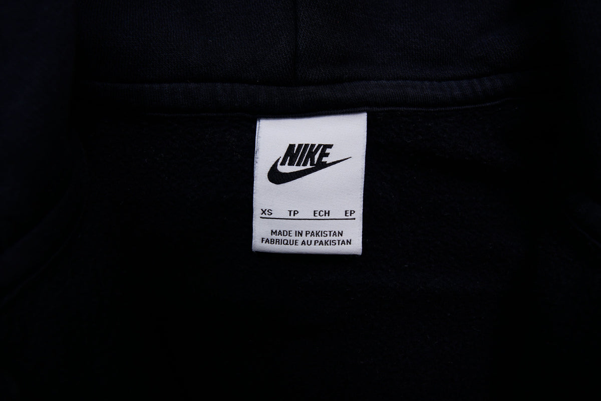 Black Nike zip jacket featuring a hood and embroidered white Swoosh on chest, size label
