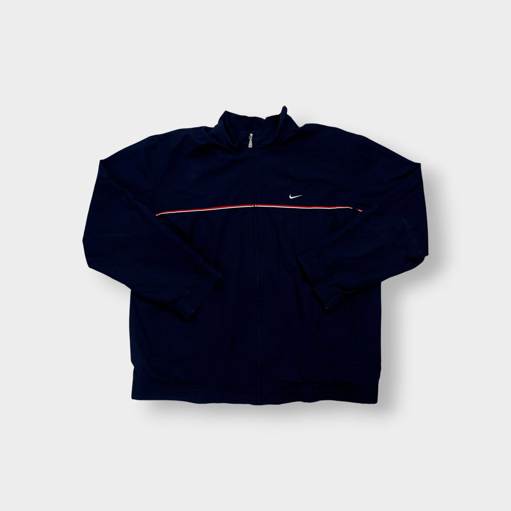 Navy Nike jacket featuring a white embroidered Swoosh logo and a red chest stripe