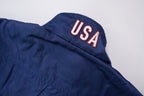 Nike track jacket in navy blue featuring an embroidered US Soccer crest, detail 2