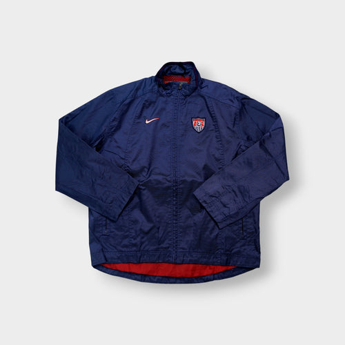 Nike track jacket in navy blue featuring an embroidered US Soccer crest
