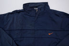 Nike jacket in navy featuring an embroidered orange Swoosh on the chest, full view
