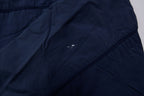 Nike jacket in navy featuring an embroidered orange Swoosh on the chest, detail 2