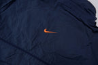 Nike jacket in navy featuring an embroidered orange Swoosh on the chest, detail 3