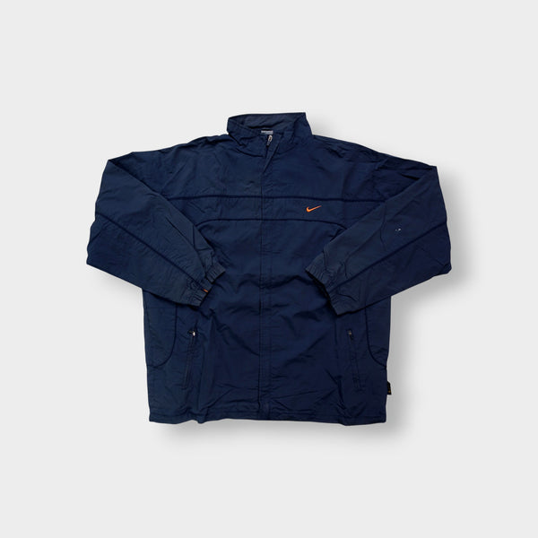 Nike jacket in navy featuring an embroidered orange Swoosh on the chest