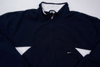 Nike zip-up track jacket in navy with red side panels and a small white swoosh logo, full view