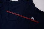 Nike zip-up track jacket in navy with red side panels and a small white swoosh logo, back view
