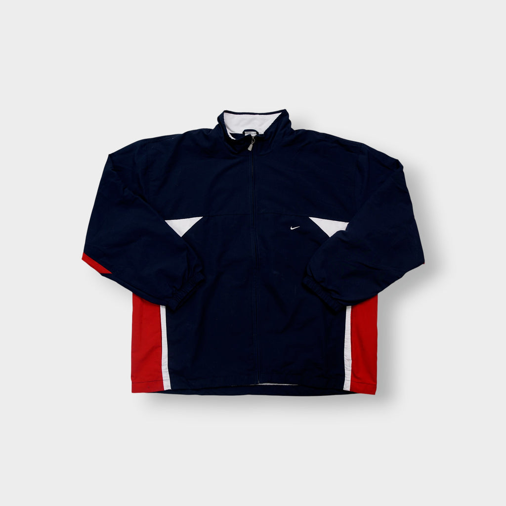 Nike zip-up track jacket in navy with red side panels and a small white swoosh logo