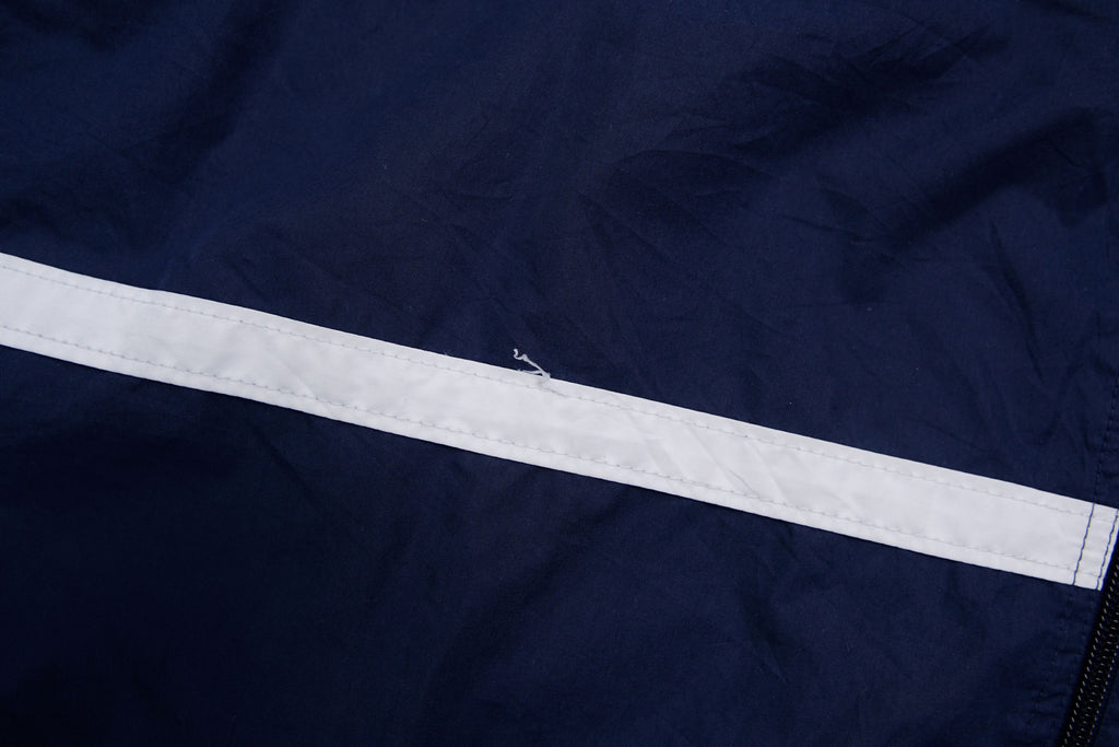 Navy Nike zip-up jacket with white contrast stripes across the chest and sleeves, detail 2