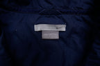 Navy Nike zip-up jacket with white contrast stripes across the chest and sleeves, size label