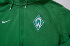 Nike zip hoodie jacket in green with an embroidered Werder Bremen crest on the chest, detail