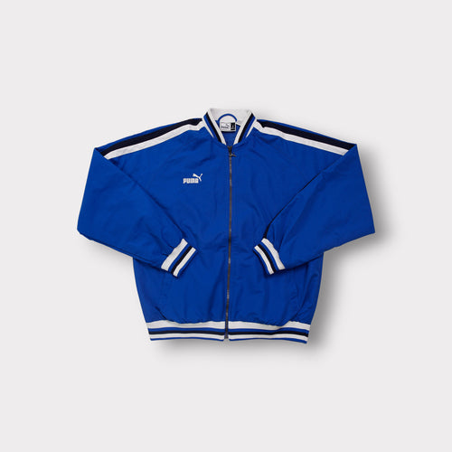 Puma King track jacket in blue with white contrast stripes and embroidered logo