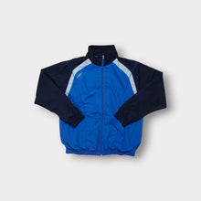 Lade das Bild in den Galerie-Viewer, Umbro jacket in blue and navy featuring a white embroidered diamond logo on the chest.