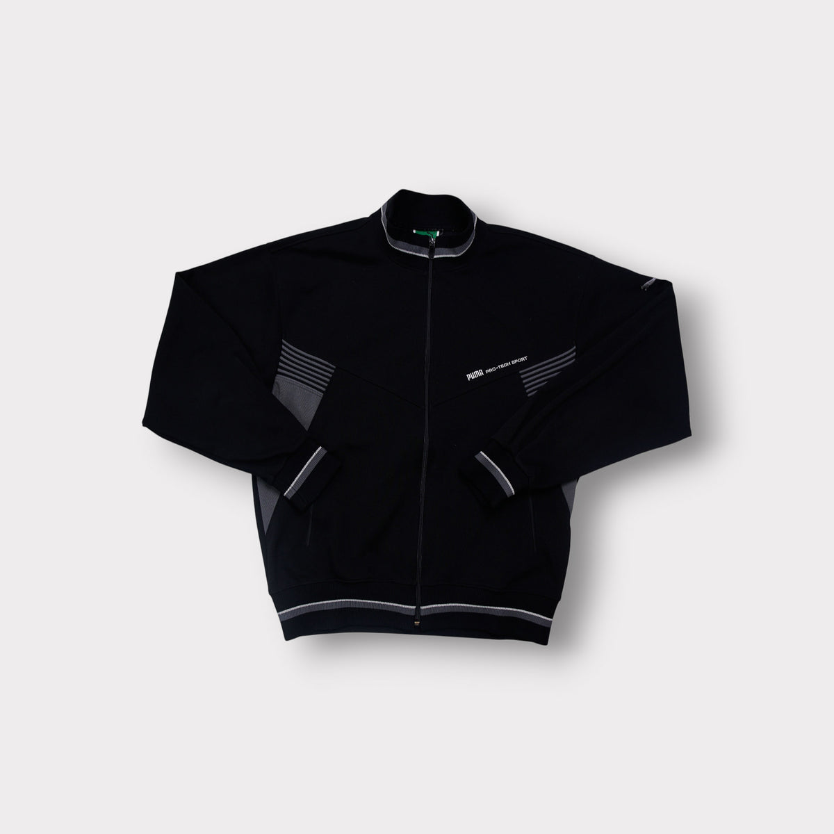 Puma track jacket in black with grey stripes and embroidered Pro-Tech Sport chest logo
