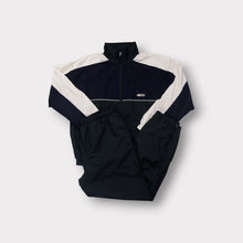 Load image into Gallery viewer, Crane tracksuit in black and white featuring a full-zip top and chest patch